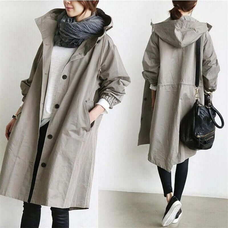 "Trench imperméable à capuche pour femme, coupe élégante, couleur noire, détails raffinés idéal pour saisons pluvieuses."