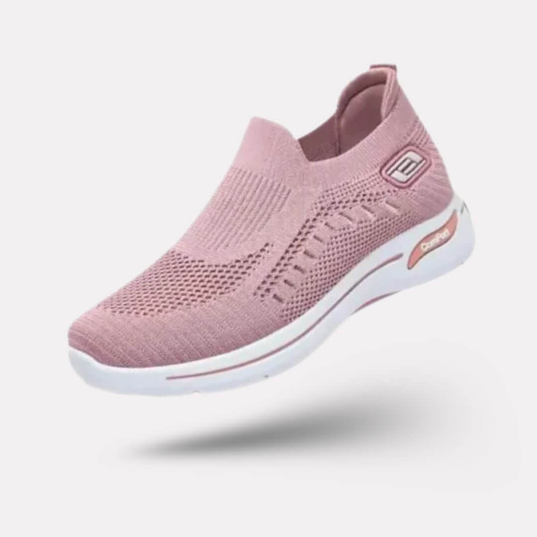 "Baskets orthopédiques pour femme en gris foncé, style moderne et semelles confortables, vue latérale élégante."