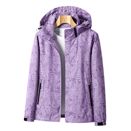 "Veste imperméable Opaline pour femme, légère et coupe-vent, avec capuche intégrée et design moderne."