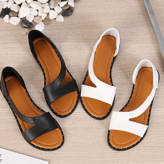 "Sandales orthopédiques de luxe pour femmes, cuir blanc et noir, design élégant et soutien confortable pour tous les jours."