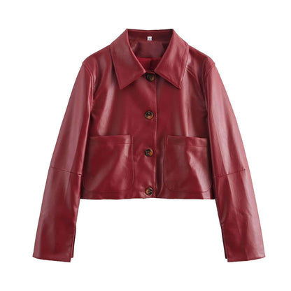 Veste en cuir rouge et marron, design épuré, boutons recouverts, finition brillante, idéale pour soirées ou virées décontract