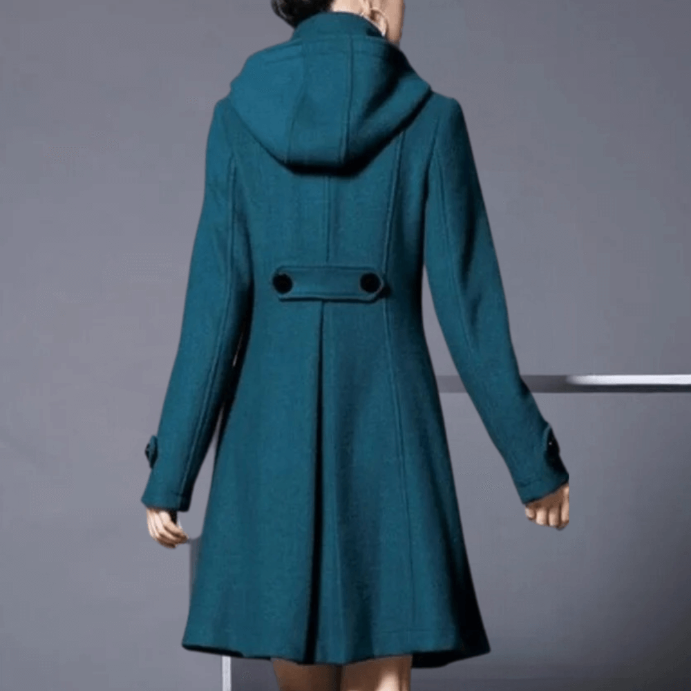 "Veste d'hiver femme élégante vert foncé avec poches latérales, coupe moderne, style sophistiqué pour occasions variées."