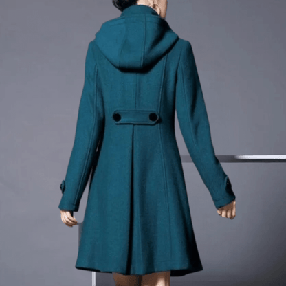 "Veste d'hiver femme élégante vert foncé avec poches latérales, coupe moderne, style sophistiqué pour occasions variées."