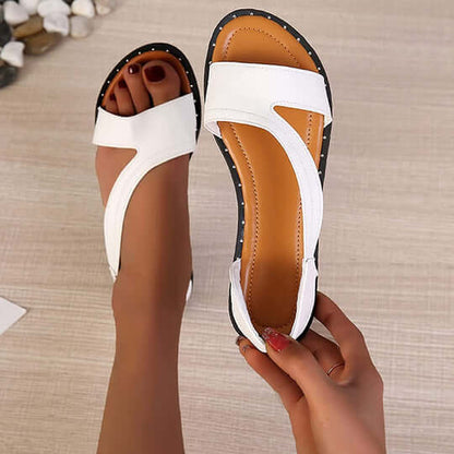 "Sandales orthopédiques de luxe pour femmes, cuir blanc et noir, design élégant et soutien confortable pour tous les jours."
