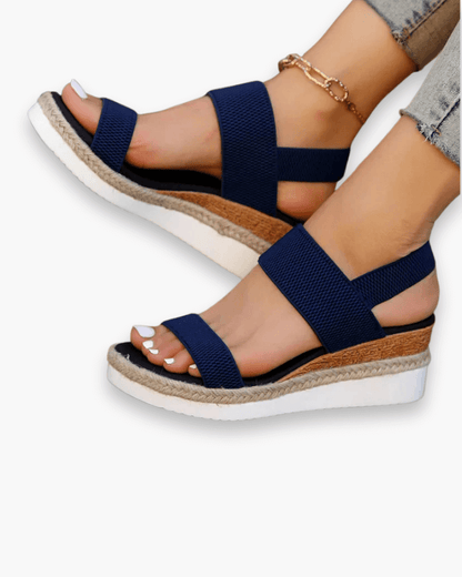 Sandales compensées élégantes pour femme, semelle haute et bride élastique, style chic idéal pour tenues estivales.