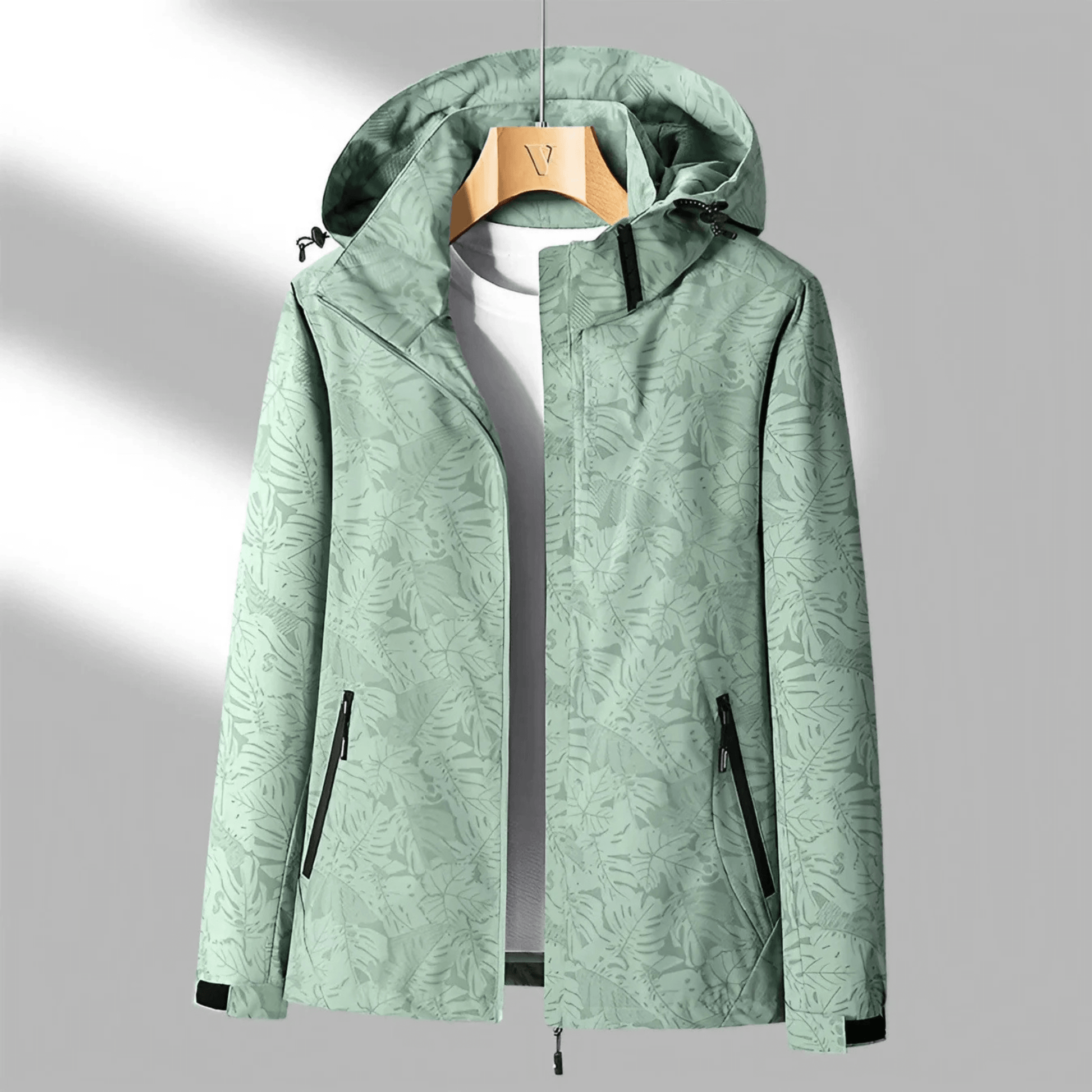 "Veste imperméable Opaline pour femme, légère et coupe-vent, avec capuche intégrée et design moderne."