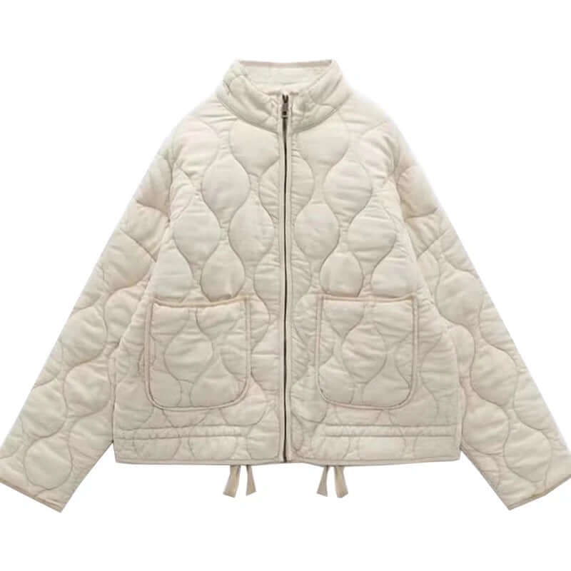 "Veste femme matelassée Yvette grise, design ondulé chic, poches pratiques, idéale mi-saison"