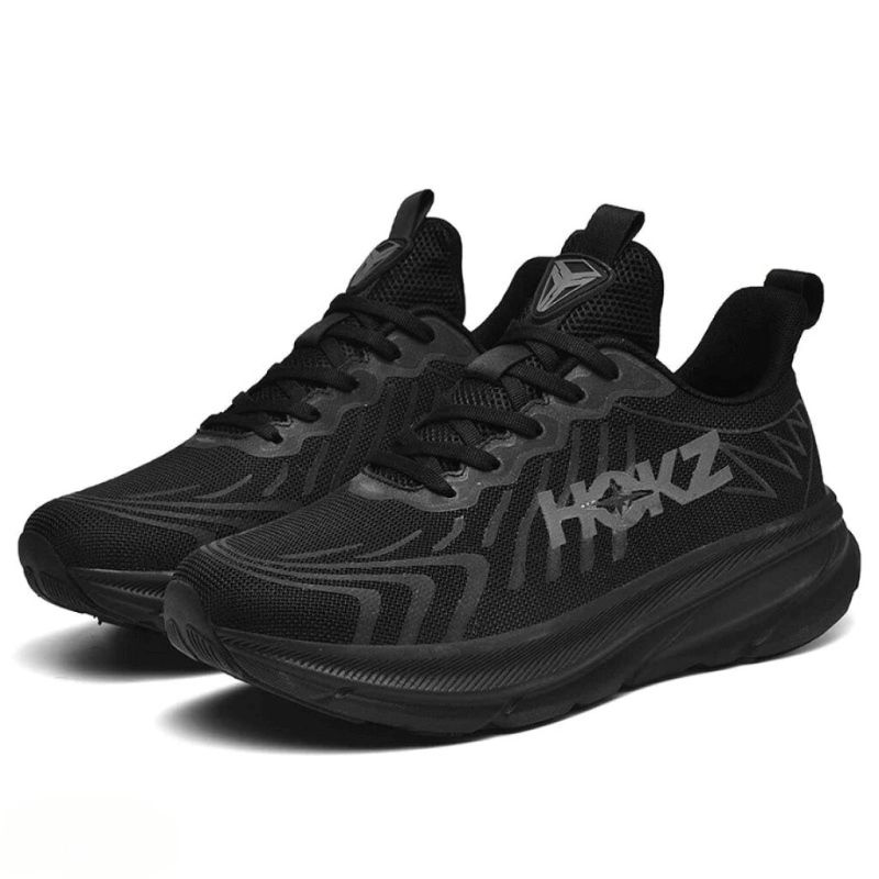 "Chaussures de course légères pour femmes, noir et blanc, avec amorti et design moderne, vue latérale"
