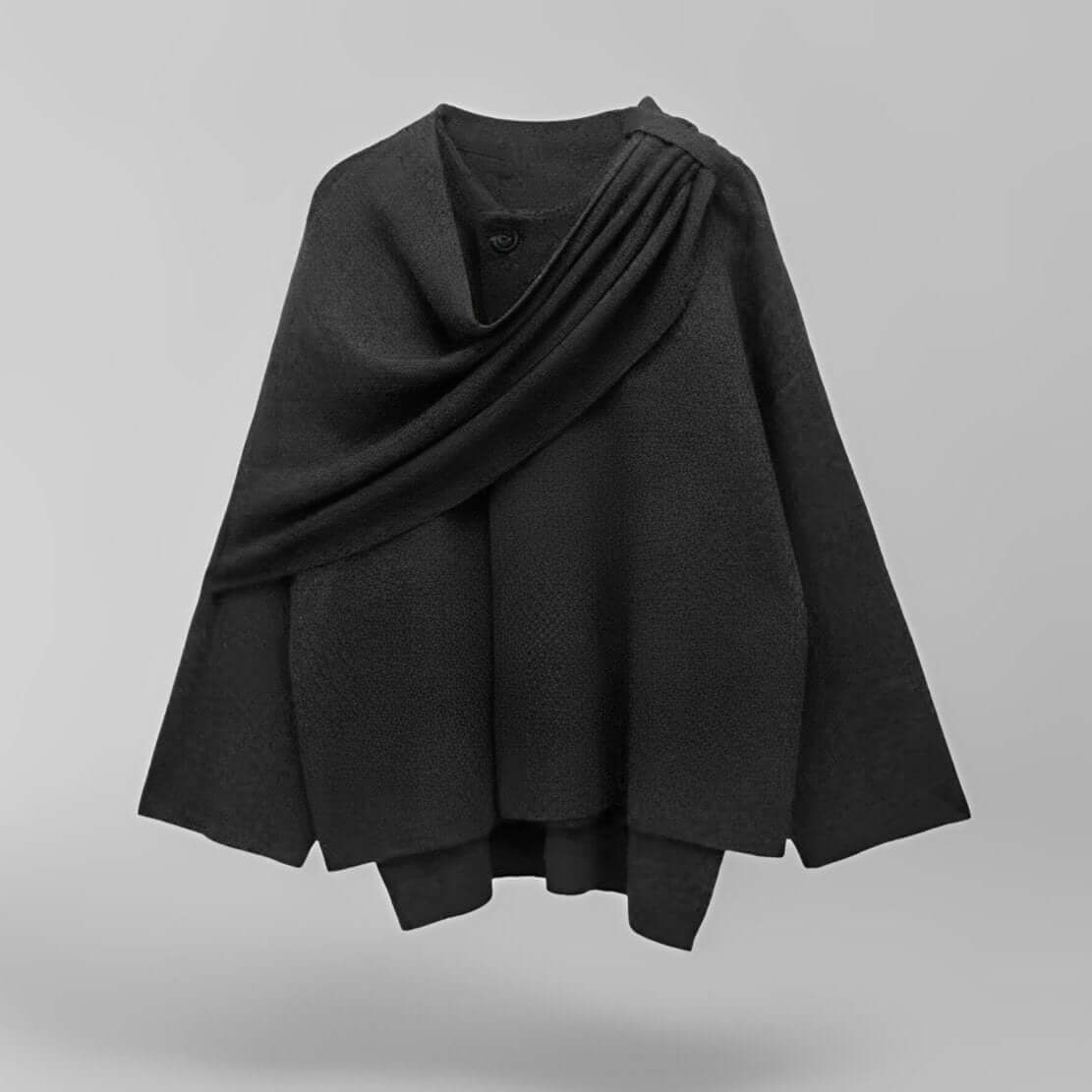 "Manteau cape femme chic automne, design asymétrique gris, tissu doux, style moderne et confortable pour temps frais."