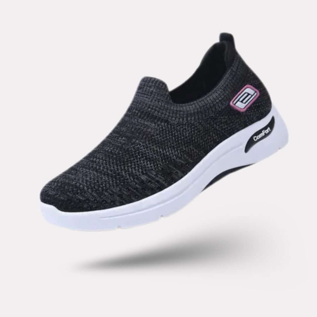 "Baskets orthopédiques pour femme en gris foncé, style moderne et semelles confortables, vue latérale élégante."