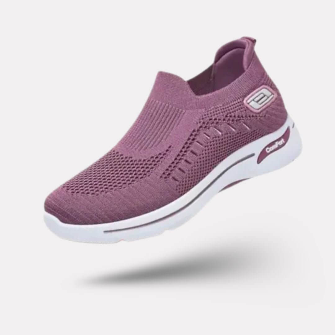 "Baskets orthopédiques pour femme en gris foncé, style moderne et semelles confortables, vue latérale élégante."