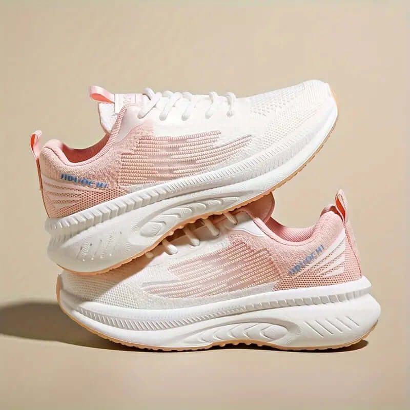 "Baskets femme orthopédiques rose pastel, légères et respirantes, design moderne pour confort et style quotidien."